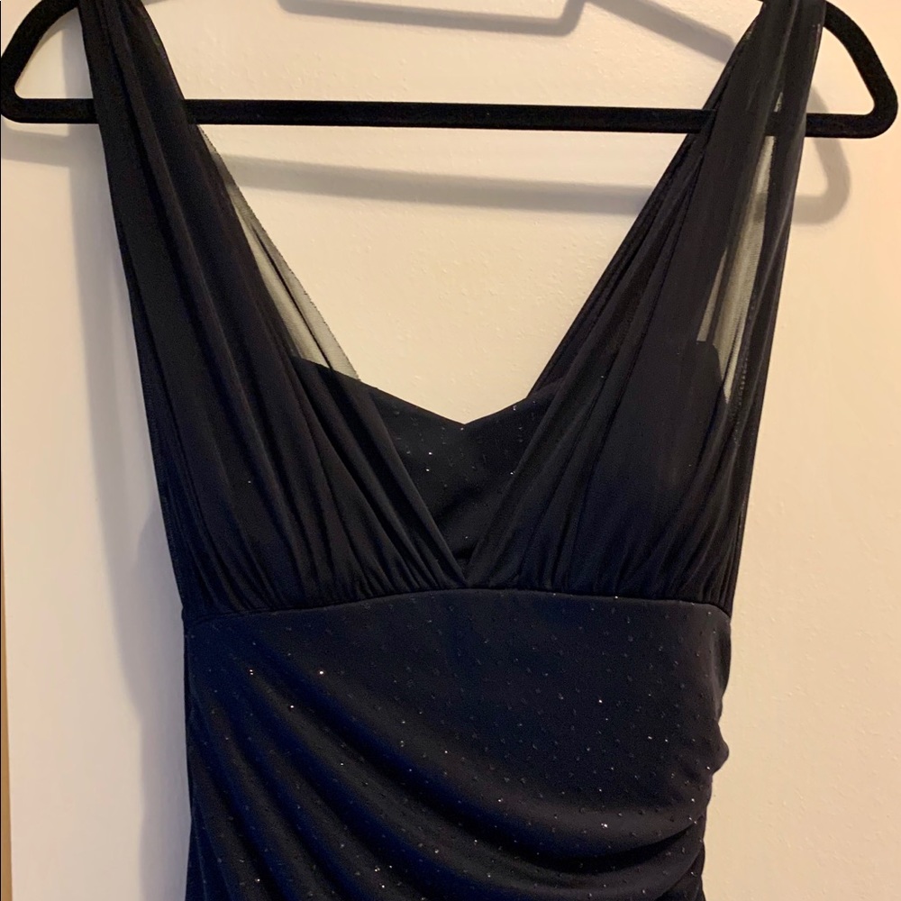 Black evening gown, very flattering.